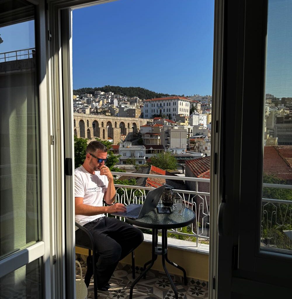 working from laptop in greece