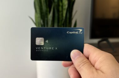Nomadic Matt holding up his Capital One Venture X business card